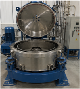 Industrial drum-type centrifuge machine with the lid open