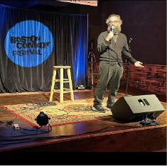 Event branding projected on a stage backdrop